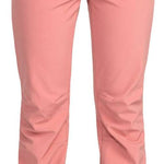 Roxy Women's Rising High Pant 2024 - A pair of pink snow pants with a black waistband and three black buttons at the back.