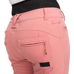 Roxy Women's Rising High Pant 2024 - A pair of pink pants with a subtle floral pattern on the upper thigh area.