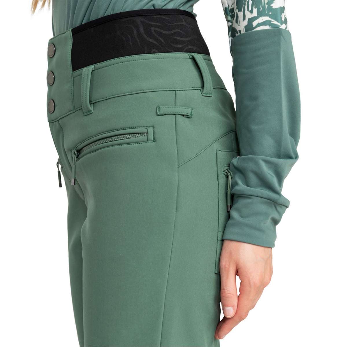 Roxy Women's Rising High Pant 2024 - A pair of women's high-waisted snow pants in a light green color with black zippers and buttons.