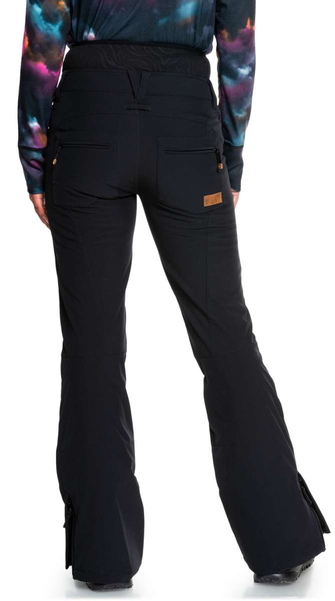 Roxy Women's Rising High Pants 2022 - Black snow pants with zippered pockets and a brown logo patch on the back pocket.