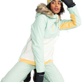 Roxy Women's Shelter Insulated Jacket 2024 - A mint green jacket with a fur-lined hood and yellow accents on the chest, sleeves, and waistband.