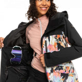 Roxy Women's Stated Insulated Jacket - A black jacket with a white and pink abstract design on the front, featuring a hood and zippered pockets.
