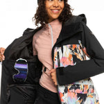 Roxy Women's Stated Insulated Jacket - A black jacket with a white and pink abstract design on the front, featuring a hood and zippered pockets.
