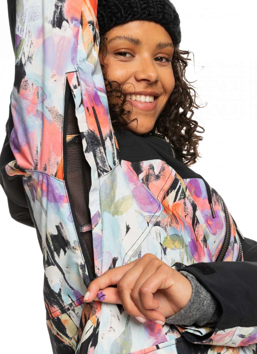 Roxy Women's Stated Insulated Jacket 2023 - A white jacket with a multicolored abstract pattern, featuring black accents and a zippered pocket on the chest.