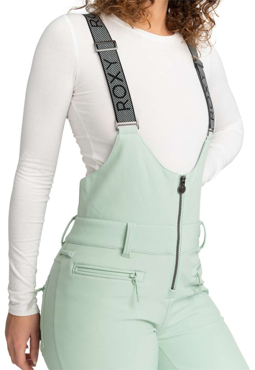 Roxy Women's Summit Bib Shell Pants 2024 - Light blue bib shell pants with a white logo on the left thigh and black drawstring at waist.