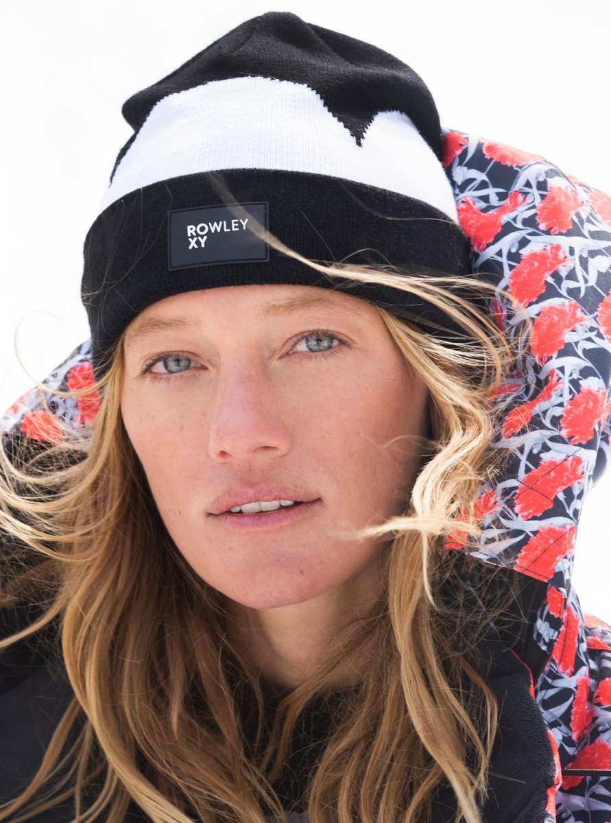 Roxy X Rowley Women's Beanie 2022 - A black beanie with a white stripe and a rectangular patch that says "ROWLEY XY" in white letters.