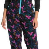 Roxy X Rowley Women's Insulated Bib Pants 2024 - Black bib pants with a floral pattern of pink, blue and brown flowers.