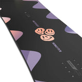 Salomon Girls Oh Yeah Grom Snowboard 2024 - A black snowboard with a pink and purple design featuring three stylized smiley faces in the center.