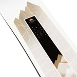 Salomon Women's Bliss Snowboard 2024 - A black snowboard with a white logo and text on top of a wooden background.