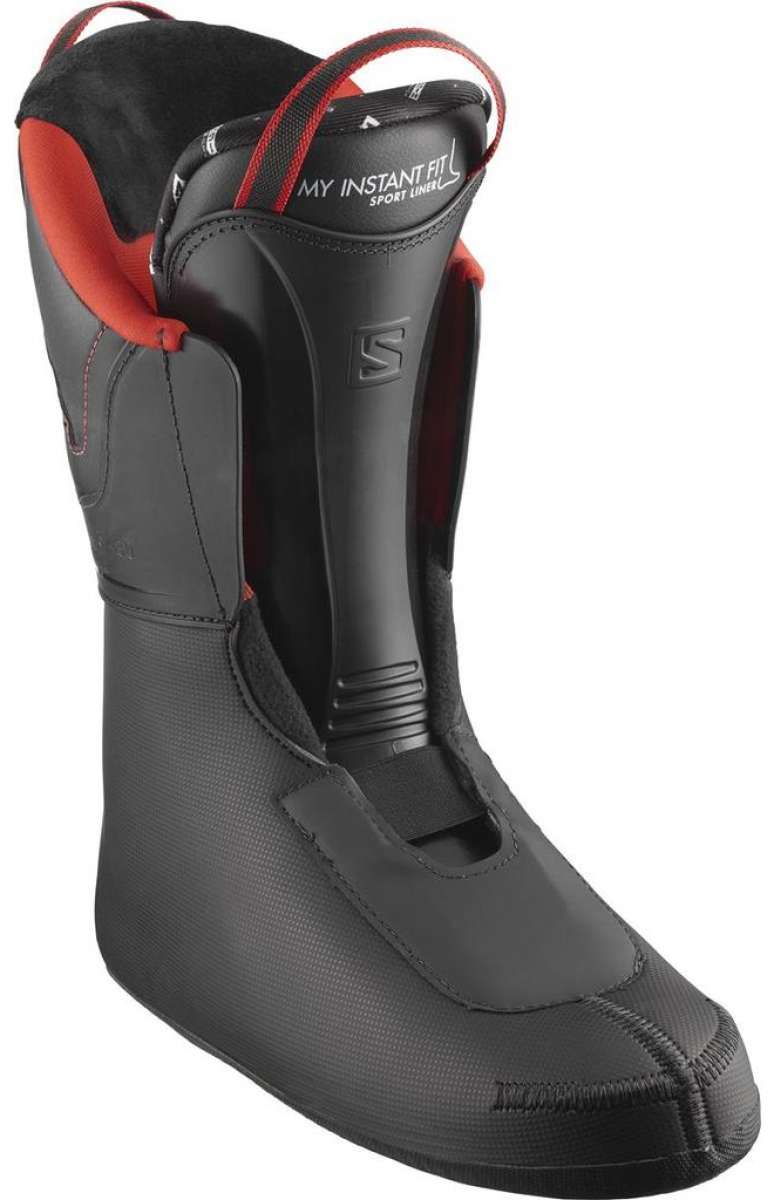 Salomon Select HV 100 Ski Boots 2024 - Black ski boots with a textured pattern on the side and red accents around the ankle strap.