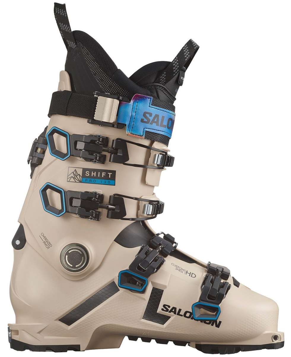 Salomon Shift Pro 130 AT Ski Boots 2024 - Beige ski boots with black buckles and straps, featuring a blue logo on the side.