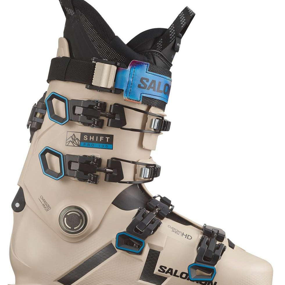 Salomon Shift Pro 130 AT Ski Boots 2024 - Beige ski boots with black buckles and straps, featuring a blue logo on the side.