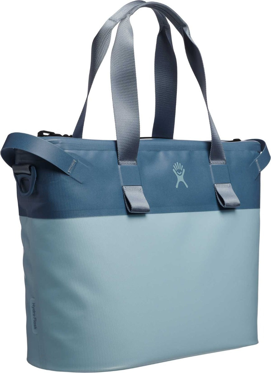 Hydro Flask 18L Day Escape Soft Cooler Tote - A large, light blue cooler bag with a zippered top and two long straps.