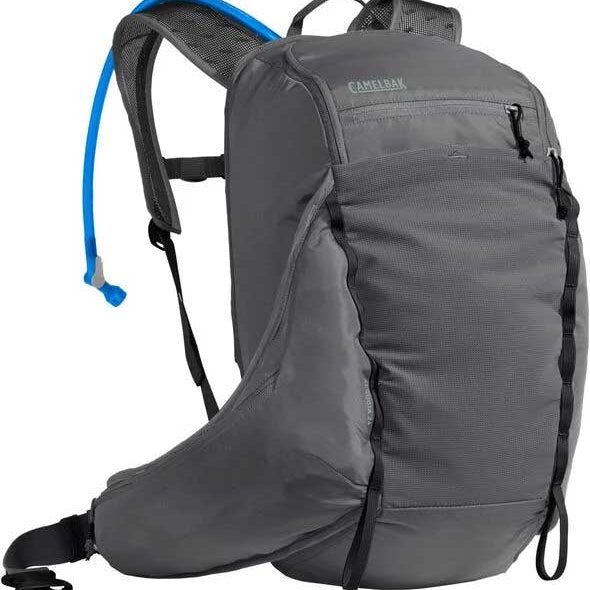 Camelbak Women's Sequoia 24 100 oz Hydration Pack - A gray hydration pack with a blue hose and black accents, featuring a zippered pocket on the front.