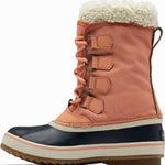 Sorel Ladies Winter Carnival Boot 2022-2023 - A pair of tall, dark brown boots with a thick cream-colored fur lining at the top and laces down the front.