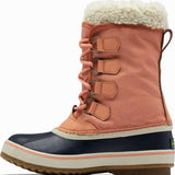 Sorel Ladies Winter Carnival Boot 2022-2023 - A pair of tall, dark brown boots with a thick cream-colored fur lining at the top and laces down the front.