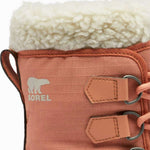Sorel - A pair of women's boots with a white fur trim around the top and a brown leather upper portion.