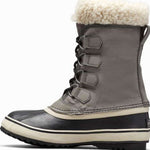 Sorel Ladies Winter Carnival Boot 2022-2023 - A tall, dark brown boot with a thick cream-colored sole and laces.