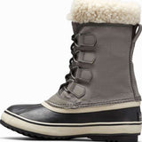 Sorel Ladies Winter Carnival Boot 2022-2023 - A tall, dark brown boot with a thick cream-colored sole and laces.