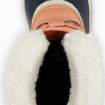 Sorel Ladies Winter Carnival Boot 2022-2023 - A navy blue boot with a white fur trim around the top and a thick cream-colored sole.