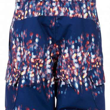 Spyder Girls Bitsy Sparkle Pant 2023 - A pair of navy blue snow pants with a sparkly pattern on the lower portion.