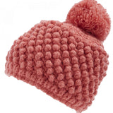 Spyder Girls Brrr Berry Beanie 2023 - A dusty rose-colored beanie with a pom-pom on top, featuring a bubble knit pattern and a folded cuff at the bottom.