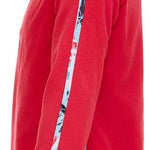 Spyder Girls Speed Fleece Zip Turtleneck 2022 - A coral fleece zip-up turtleneck with a white and black abstract patterned stripe down the side.