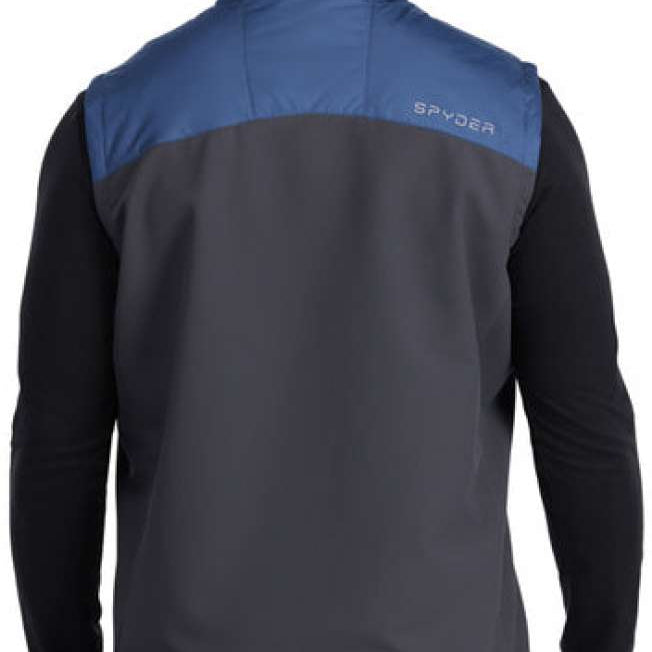 Spyder Glissade Hybrid Insulated Vest 2023 - A blue and grey vest with a high collar, worn by a model over a black long-sleeved shirt.