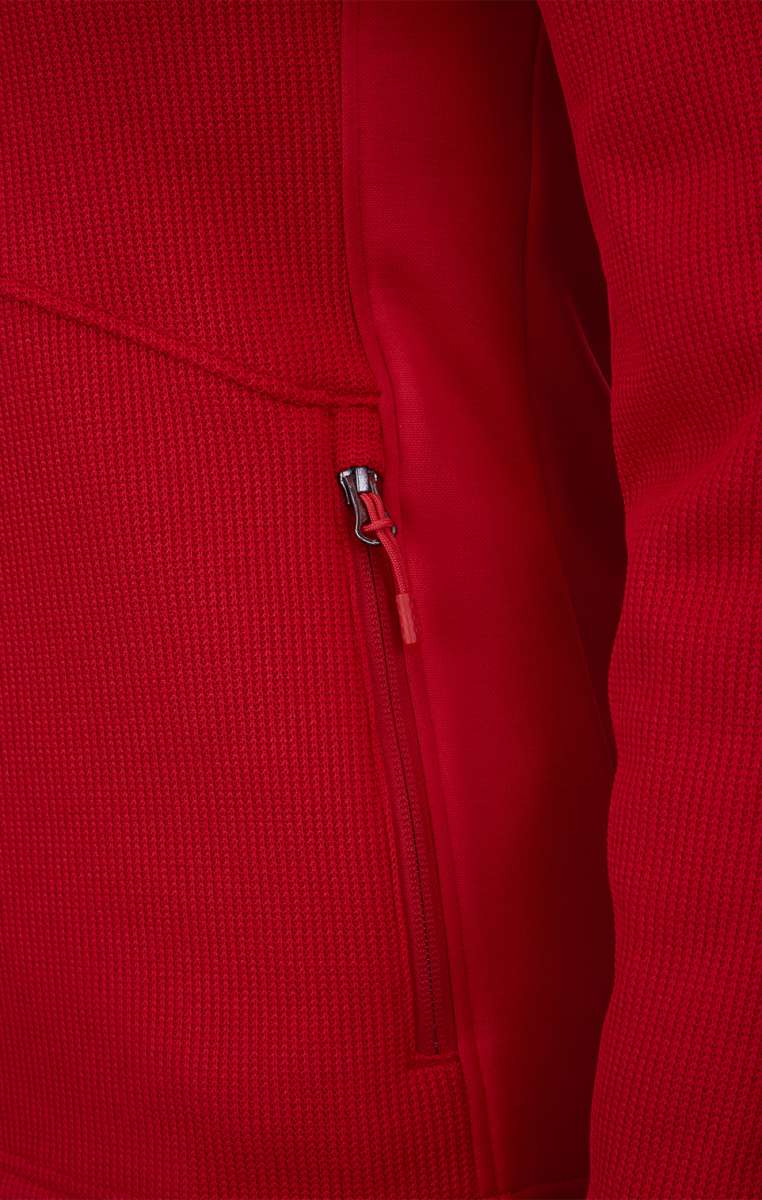 Spyder Ladies Bandita Full-Zip Fleece Jacket 2023 - A red fleece jacket with a full zip and two zippered pockets on the front.
