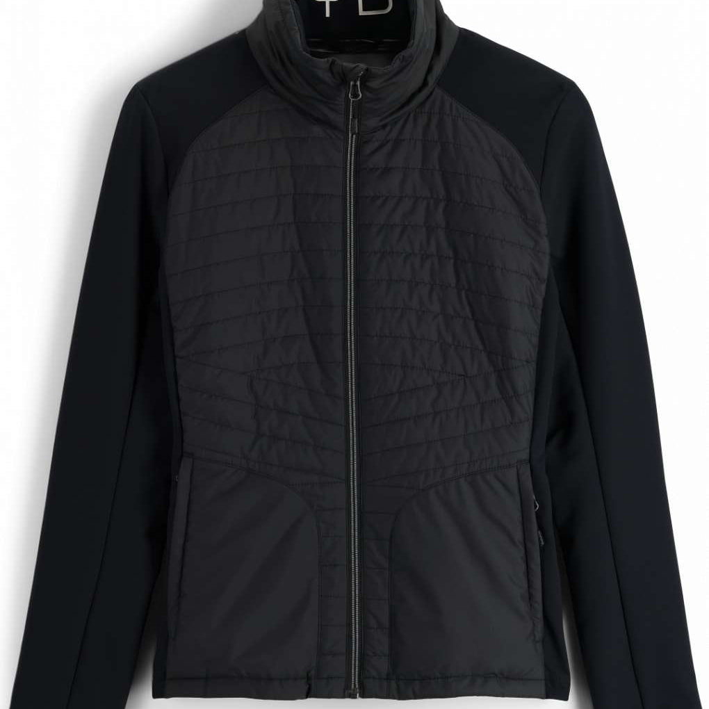 Spyder Ladies Glissade Hybrid Insulated Jacket 2023 - A black jacket with a quilted pattern on the front and back, featuring a zipper down the center.