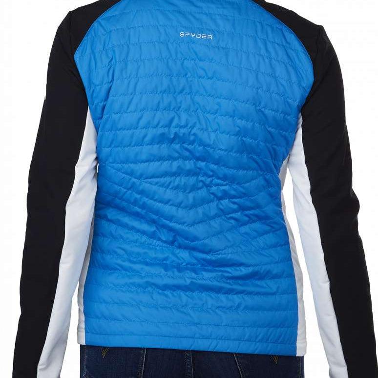 Spyder Ladies Glissade Hybrid Insulated Jacket 2023 - A blue jacket with a high collar and quilted pattern on the back, worn by a model with blonde hair.