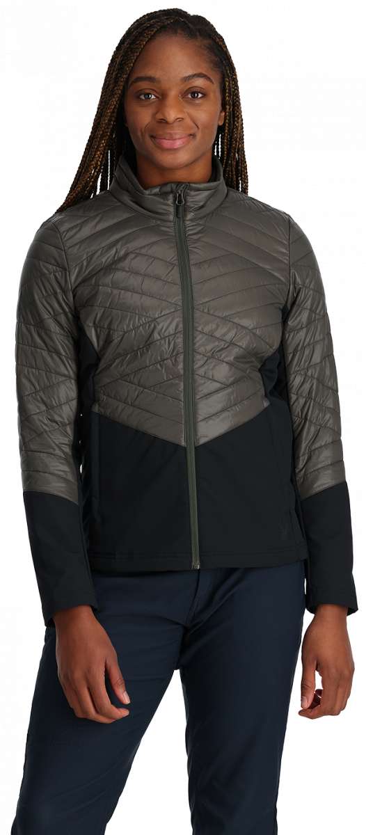 Spyder Ladies Glissade Insulated Jacket - A black jacket with diagonal white stripes on the chest and sleeves, worn by a model against a light gray background.
