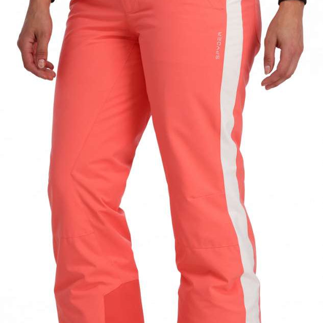 Spyder Ladies Hope Insulated Pant 2023 - A pair of coral-colored snow pants with a white stripe down the side, featuring two black buttons on the waistband.