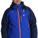 Spyder Vanqysh GORE-TEX Jacket 2024 - A royal blue jacket with orange accents and a white spider logo on the left chest.