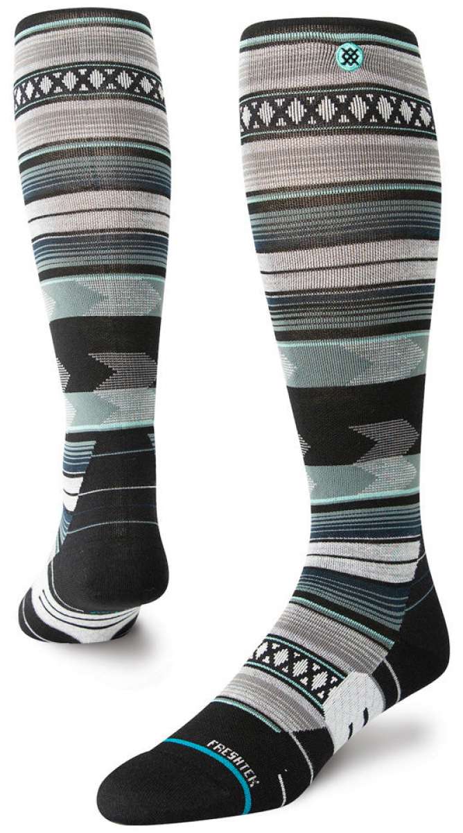Stance Baron Snow Crew Sock 2024 - A pair of black and white crew socks with a repeating pattern of snowboarders in action.