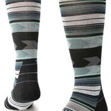 Stance Baron Snow Crew Sock 2024 - A pair of black and white crew socks with a repeating pattern of snowboarders in action.