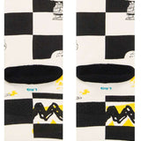 Stance Kids Checked Crew Sock 2023 - A black-and-white checked pattern with a small cartoon character in the top left corner.