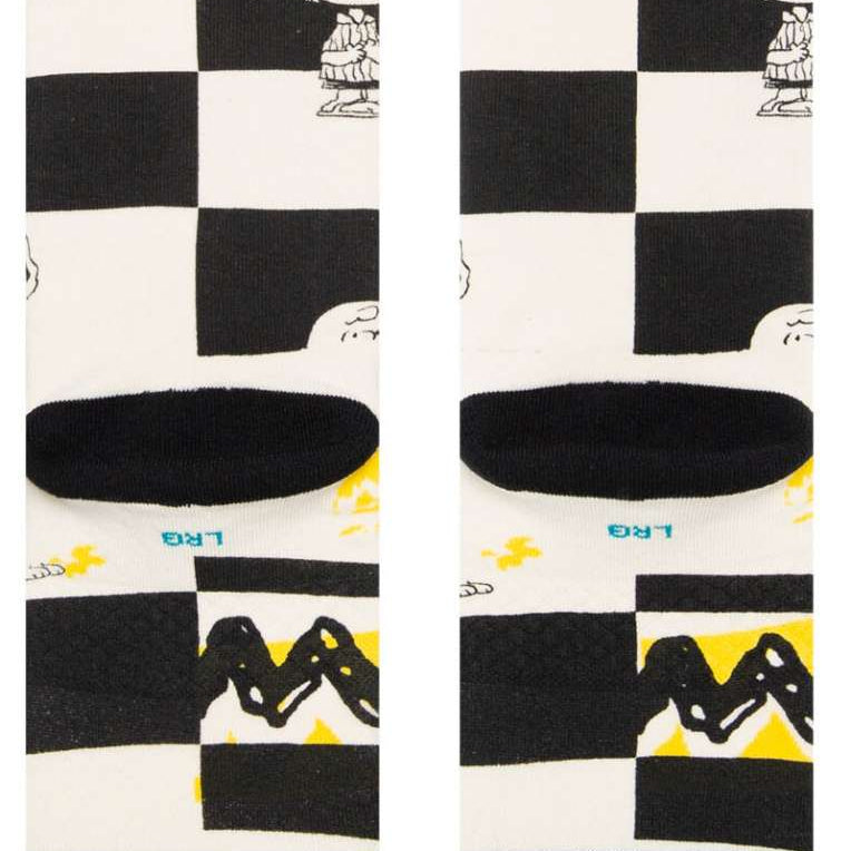 Stance Kids Checked Crew Sock 2023 - A black-and-white checked pattern with a small cartoon character in the top left corner.
