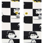 Stance Kids Checked Crew Sock 2023 - A black-and-white checked pattern with a yellow and blue stripe at the top.