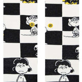 Stance Kids Checked Crew Sock 2023 - A black-and-white checked pattern with a yellow and blue stripe at the top.