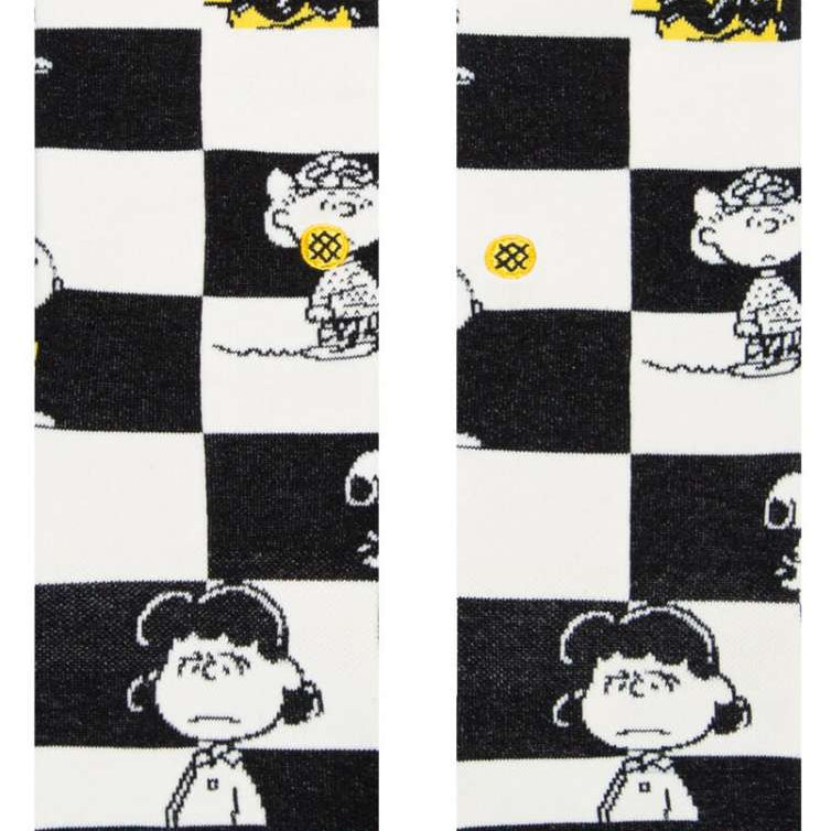 Stance Kids Checked Crew Sock 2023 - A black-and-white checked pattern with a yellow and blue stripe at the top.