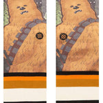 Stance Chewie By Jaz Crew Sock 2024 - A pair of crew socks featuring a large, furry Wookiee character from Star Wars with a brown body and gray bandolier.