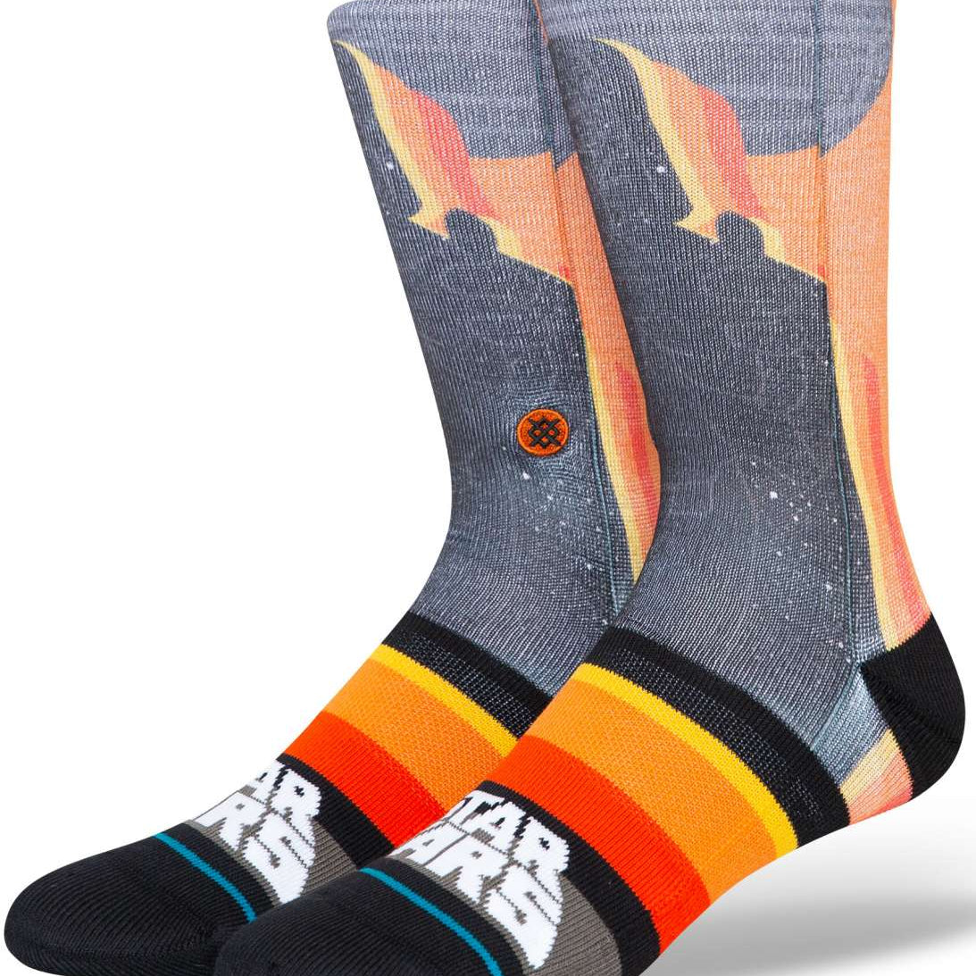 Stance Darth By Jaz Crew Sock 2024 - A pair of crew socks with a silhouette of Darth Vader in black, set against an orange and yellow gradient background.