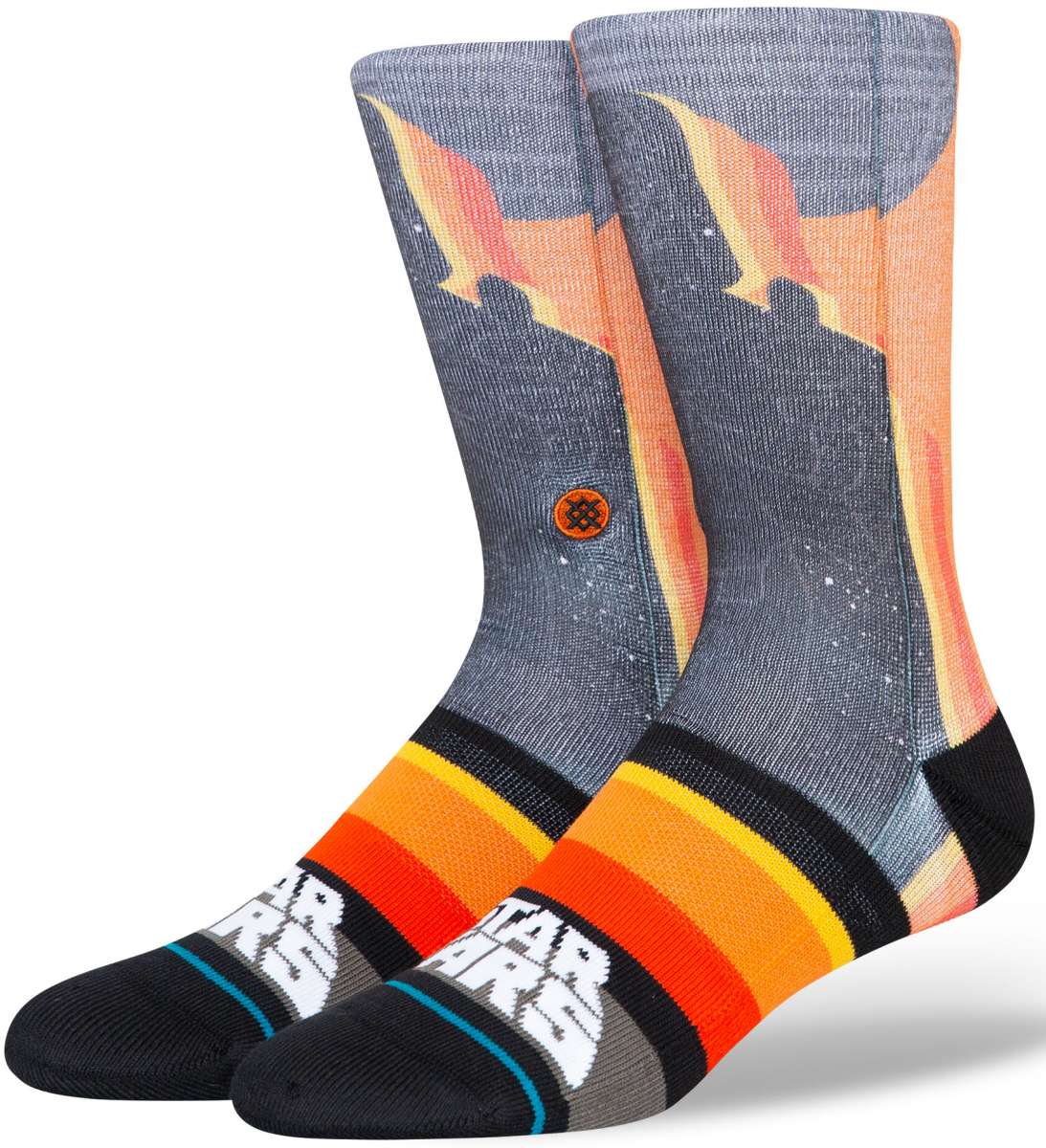 Stance Darth By Jaz Crew Sock 2024 - A pair of crew socks with a silhouette of Darth Vader in black, set against an orange and yellow gradient background.
