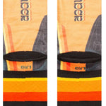 Stance Darth By Jaz Crew Sock 2024 - A pair of crew socks with a repeating pattern of Darth Vader's helmet in black and gray, on an orange background.