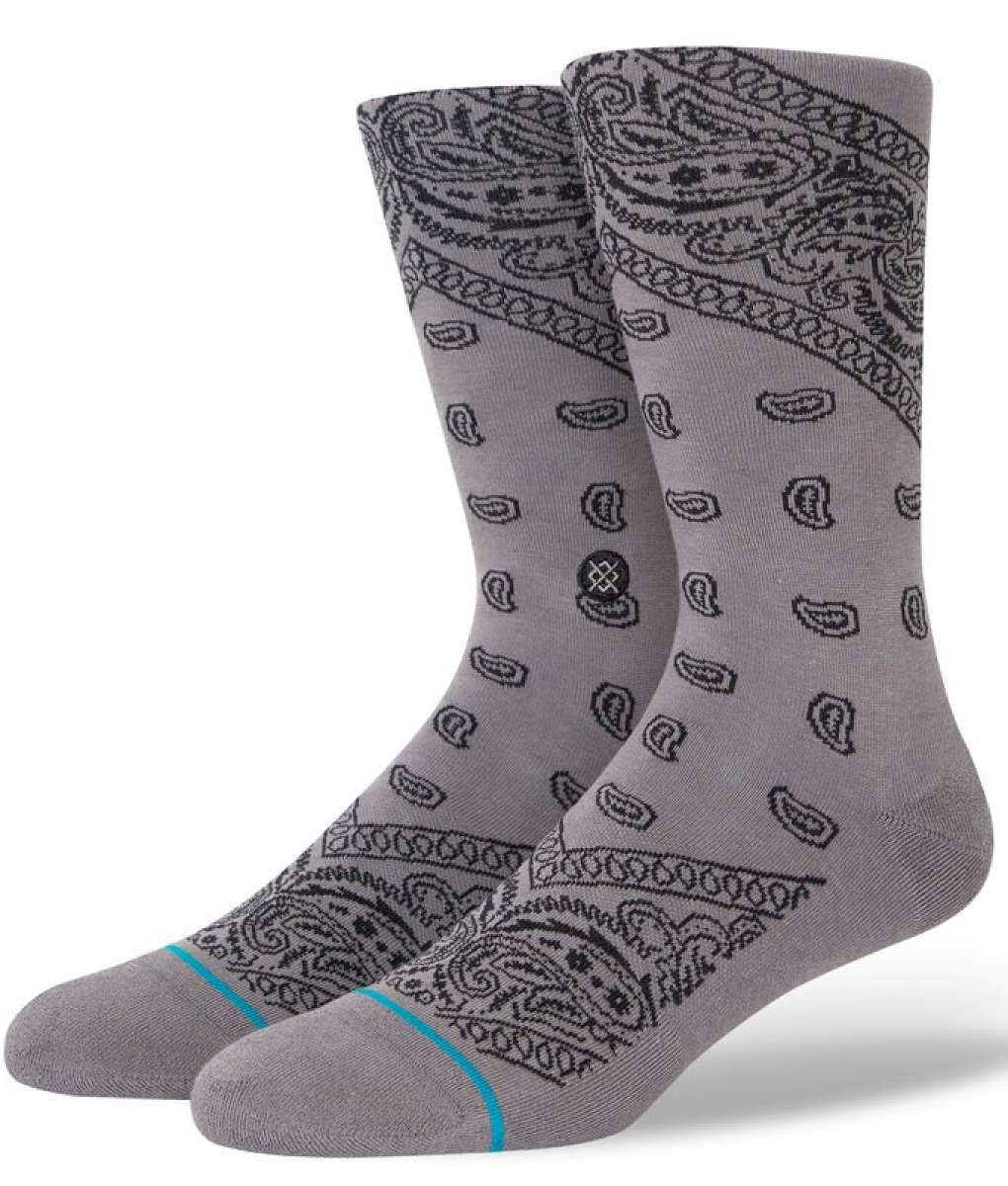 Stance El Barrio Crew Sock 2023 - A pair of gray crew socks with a paisley pattern and turquoise stripe at the toe.
