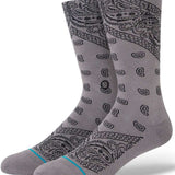 Stance El Barrio Crew Sock 2023 - A pair of gray crew socks with a paisley pattern and turquoise stripe at the toe.