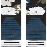 Stance Fields Snow Sock 2023 - White snowflakes on a black background with gray accents and blue dots.