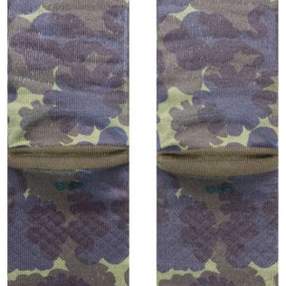 Stance Hydrangea Crew Sock 2023 - A pair of crew socks with a light purple hydrangea pattern on an olive green background.