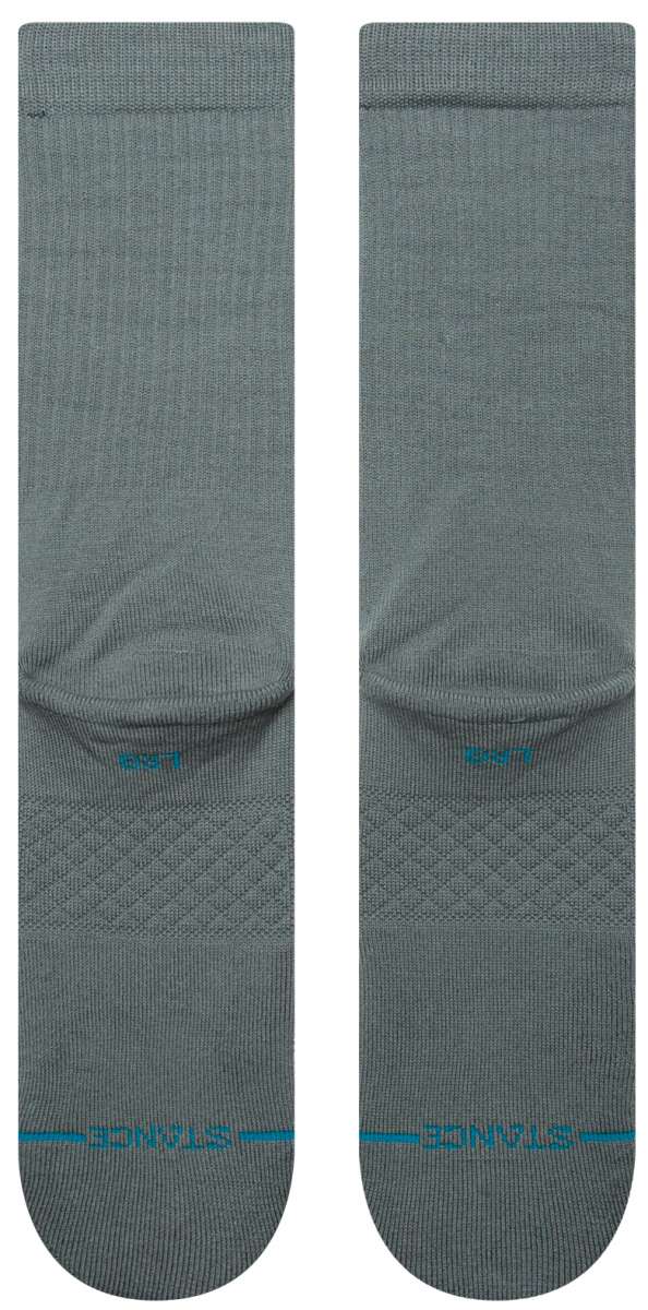 Stance Icon Crew Sock 2024 - A pair of gray crew socks with a repeating pattern of small, stylized icons in various colors.
